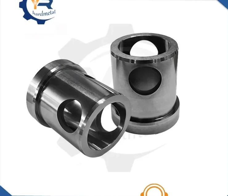 Two polished tungsten carbide cylindrical sleeves with machined side holes on a white background