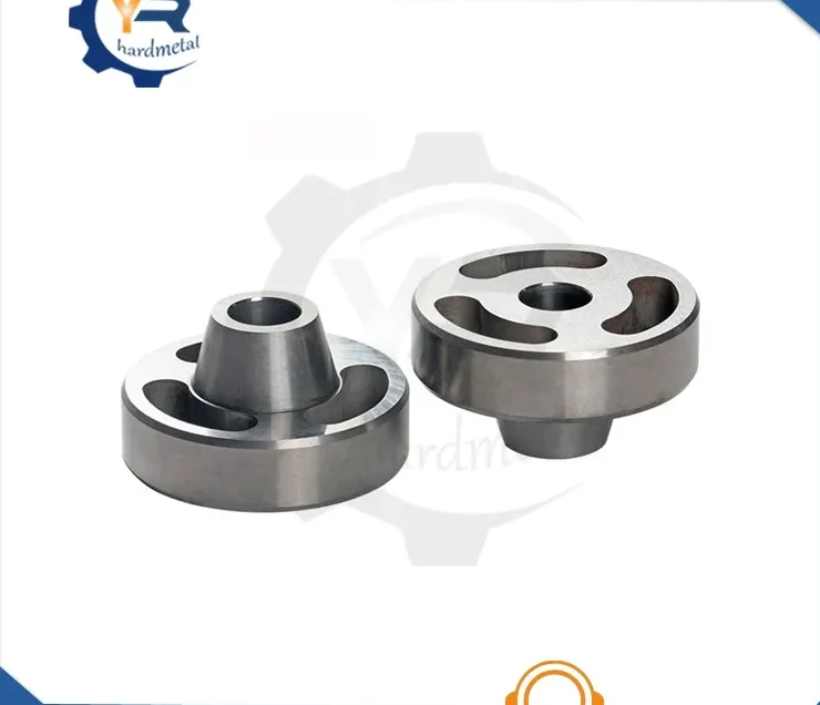 Two tungsten carbide valve-seat wear parts with curved slots and central bores on a white background