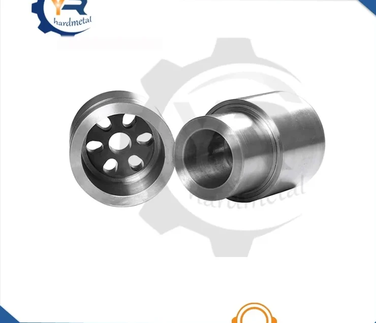 Two machined tungsten carbide cylindrical wear parts, one with circular hole pattern, on white background