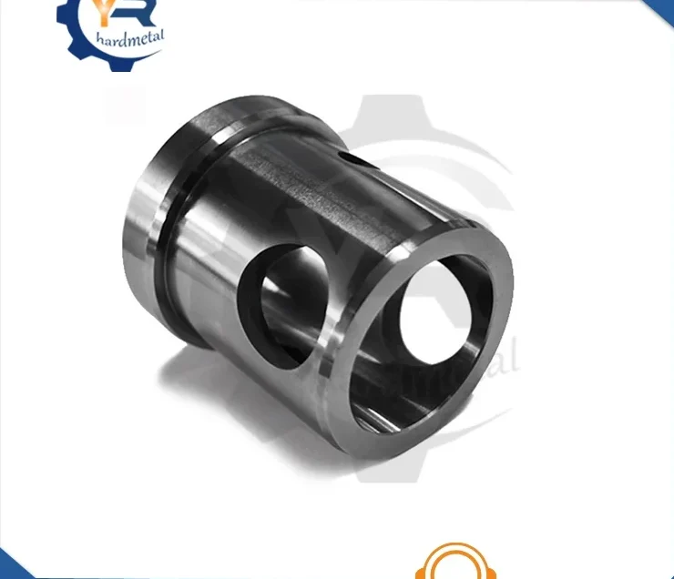 Polished cylindrical tungsten carbide sleeve with angled slots and a bored opening, shown on white background.