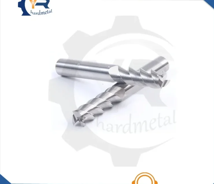 Two 3-flute carbide end mills lying crossed on a plain white background