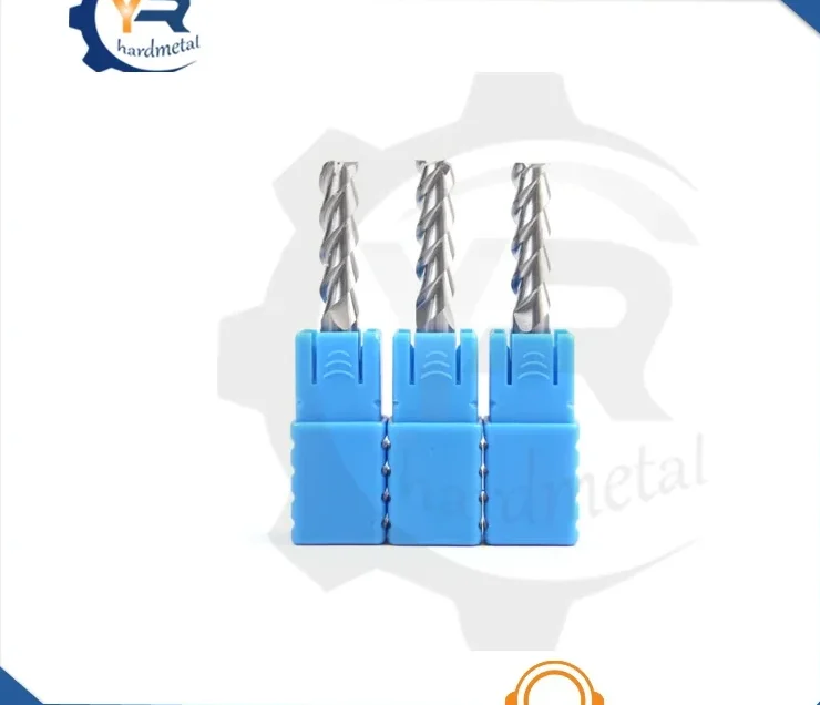 Three spiral flute carbide end mills with blue plastic handle covers on a white background