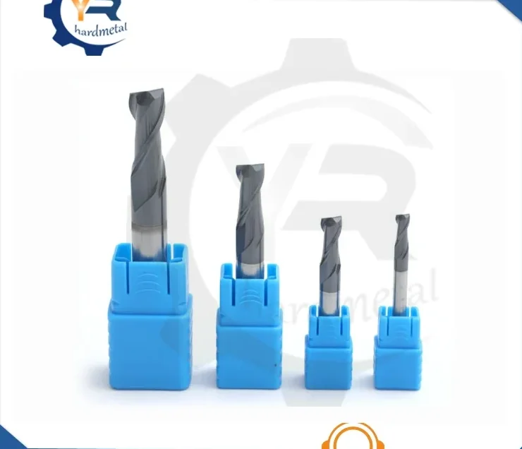 Four solid carbide end mills in descending sizes standing in blue plastic holders on a white background