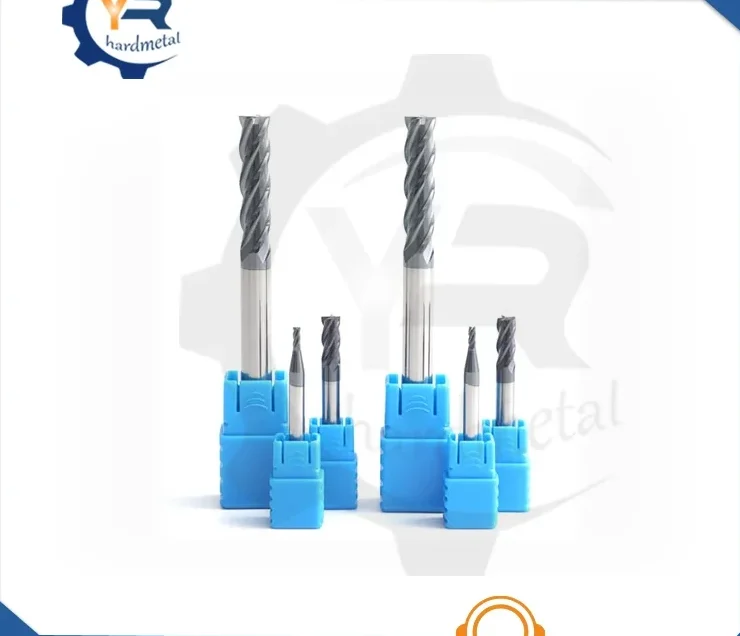 Set of solid carbide spiral-flute end mills standing in blue plastic holders on white background