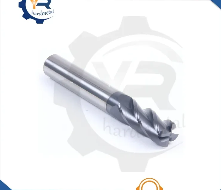 Carbide round nose end mill with helical flutes and polished shank on white background