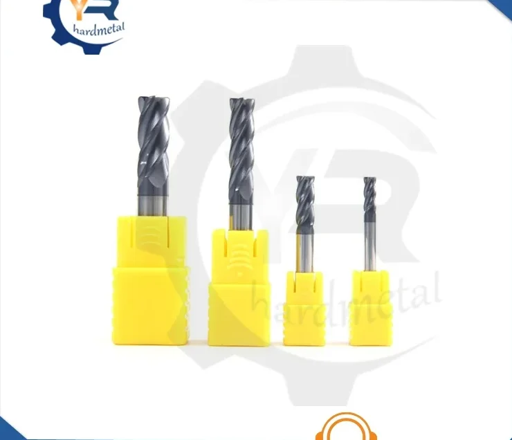 Four carbide round nose end mills of decreasing size mounted in yellow holders on a white background