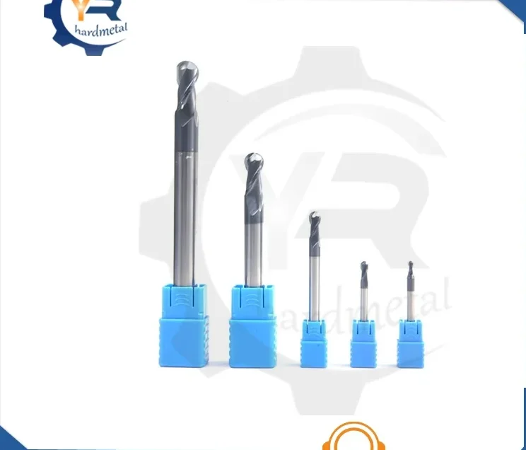 Set of carbide ball nose end mills in descending sizes with blue plastic holders on white background