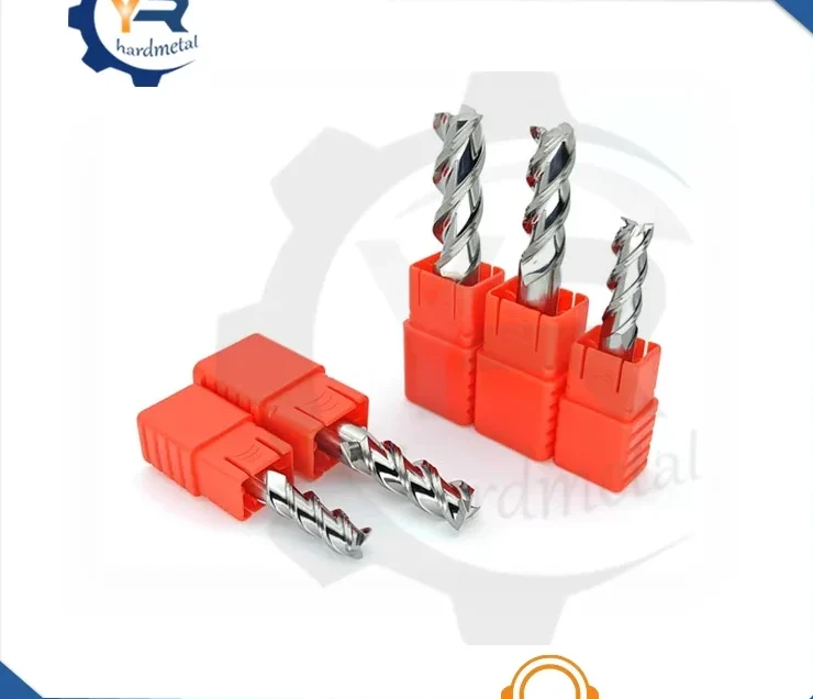 Tungsten carbide end mills with spiral flutes seated in orange plastic holders