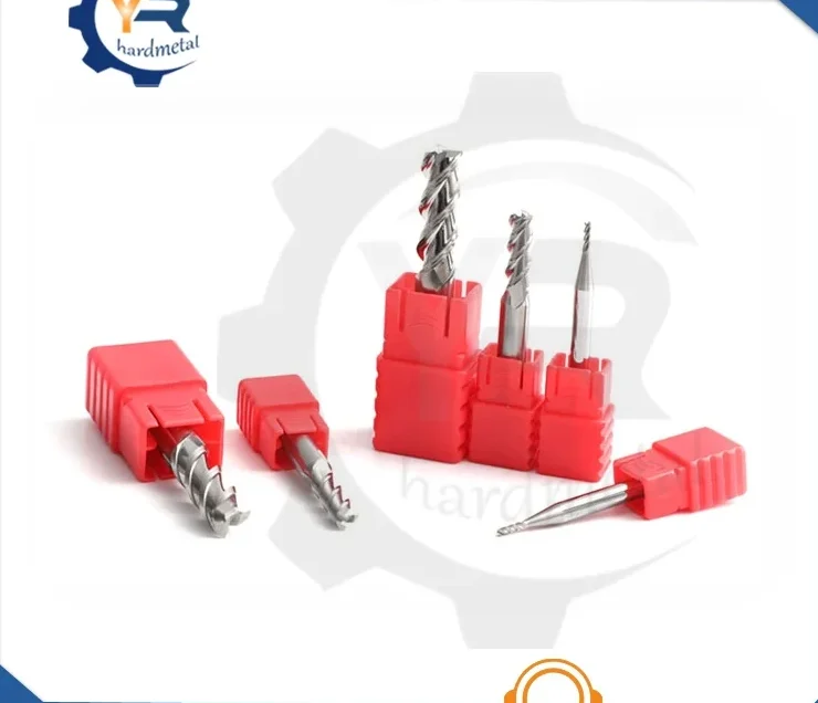 Tungsten carbide end mills in red plastic holders arranged on a white background