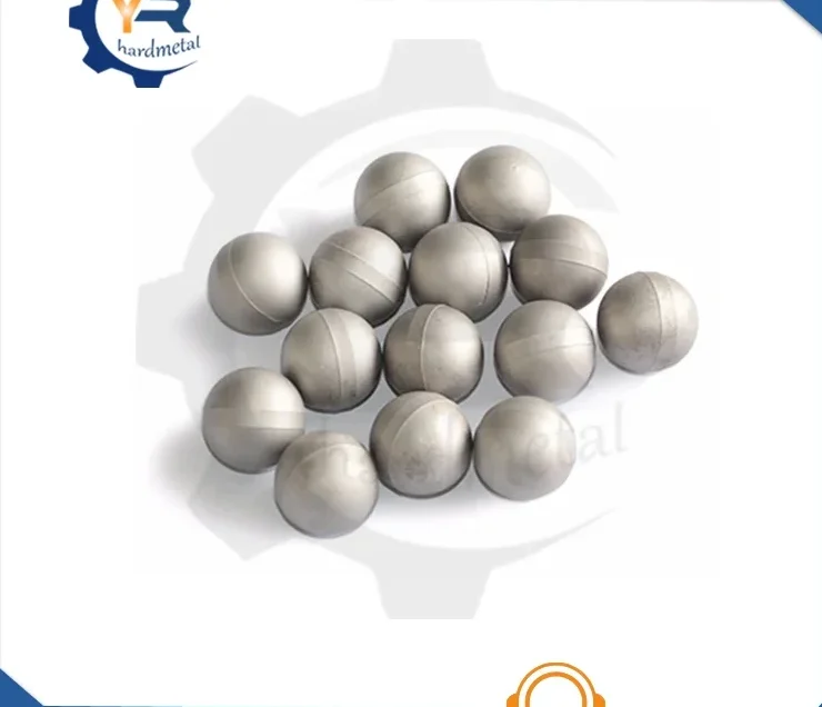 Pile of polished gray tungsten carbide balls arranged on a white background