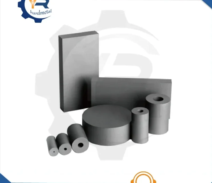 Assorted tungsten carbide products: rectangular plates, blocks, discs, and hollow cylindrical rods on white.