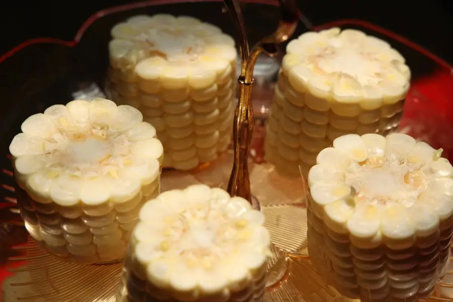 Pearl White sweet corn cut into round cob sections, ready for quick-freezing