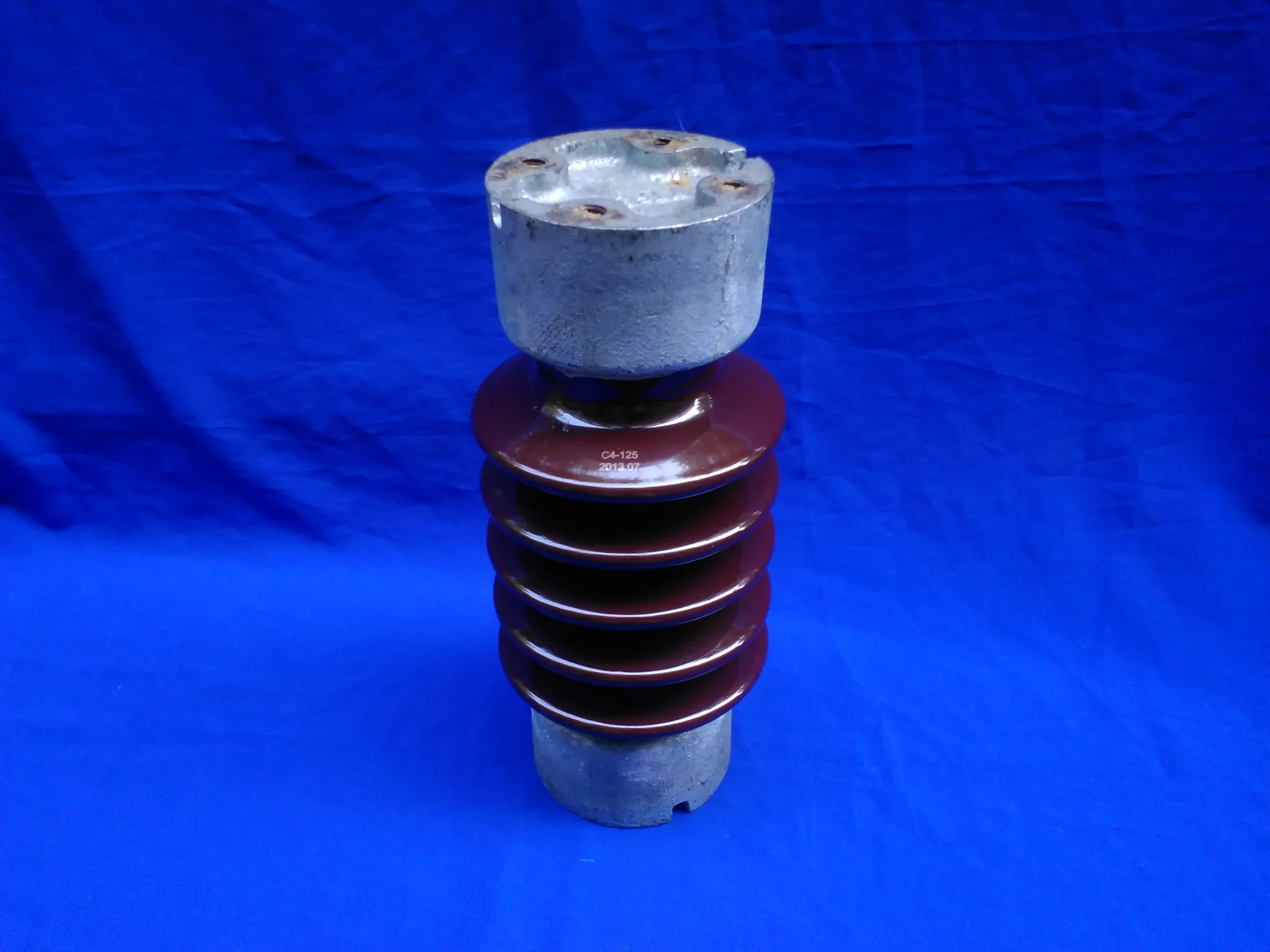 Porcelain station post insulator showing glazed shed surfaces