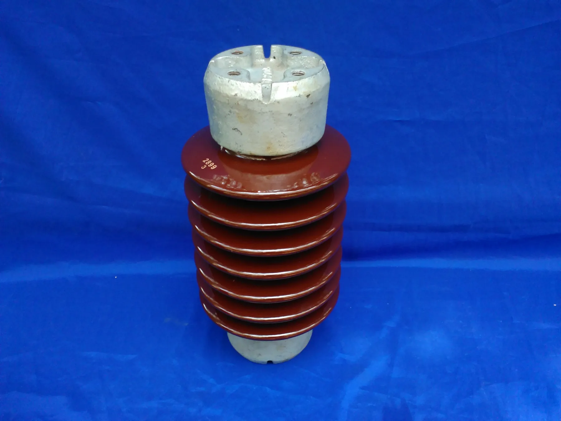 Brown glazed porcelain station post insulator with metal end fitting
