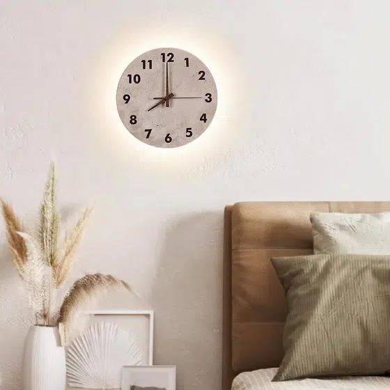 Clock Style LED Stone Wall Light in Hardware and Yellow Stone, installed view