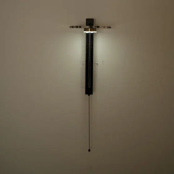 Black Linear Natural Stone Wall Light in Hardware and Bulgari Stone, scale view