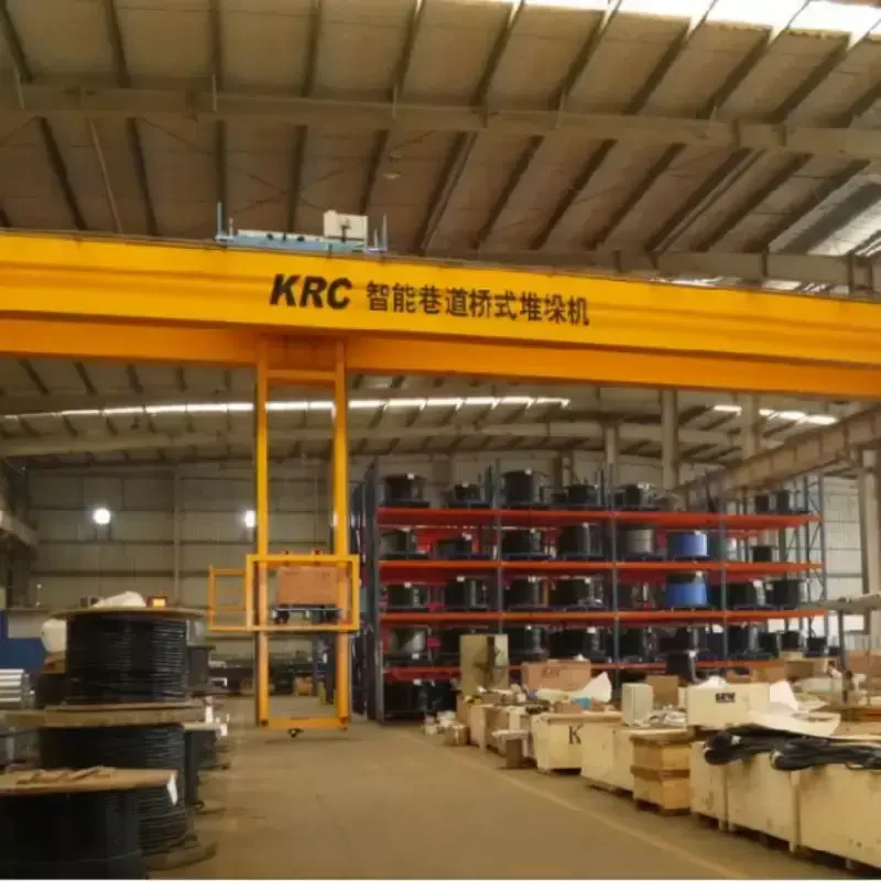 Double girder EOT crane bridge above a steel workshop
