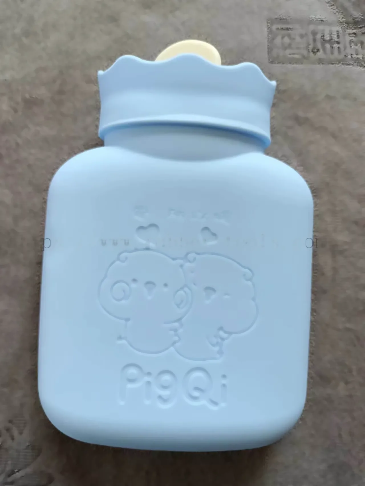 Pink silicone hot water bag for heat therapy
