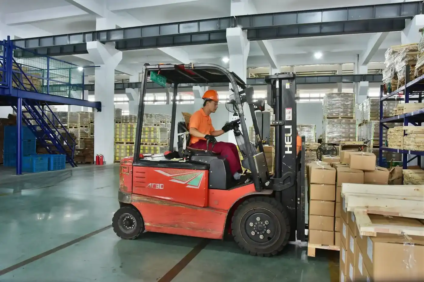 Forklift moving palletised export cartons in the loading bay