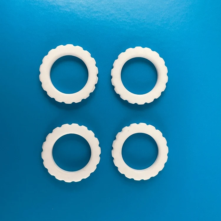 Group of white alumina ceramic rings in several bore and wall sizes
