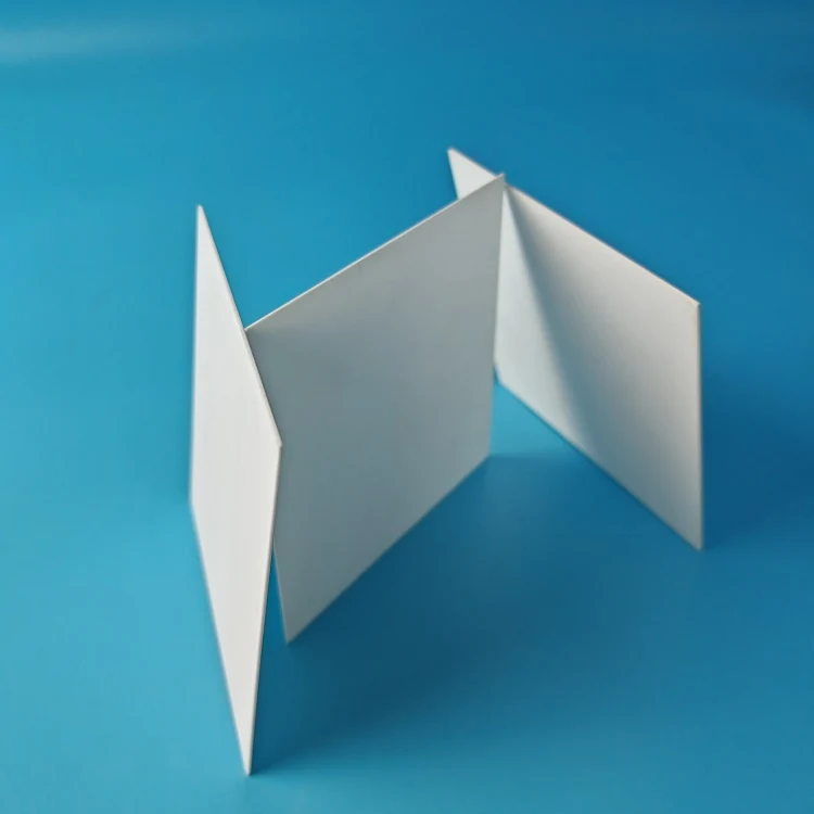 White 99% alumina ceramic blank plates and sheets on a blue background