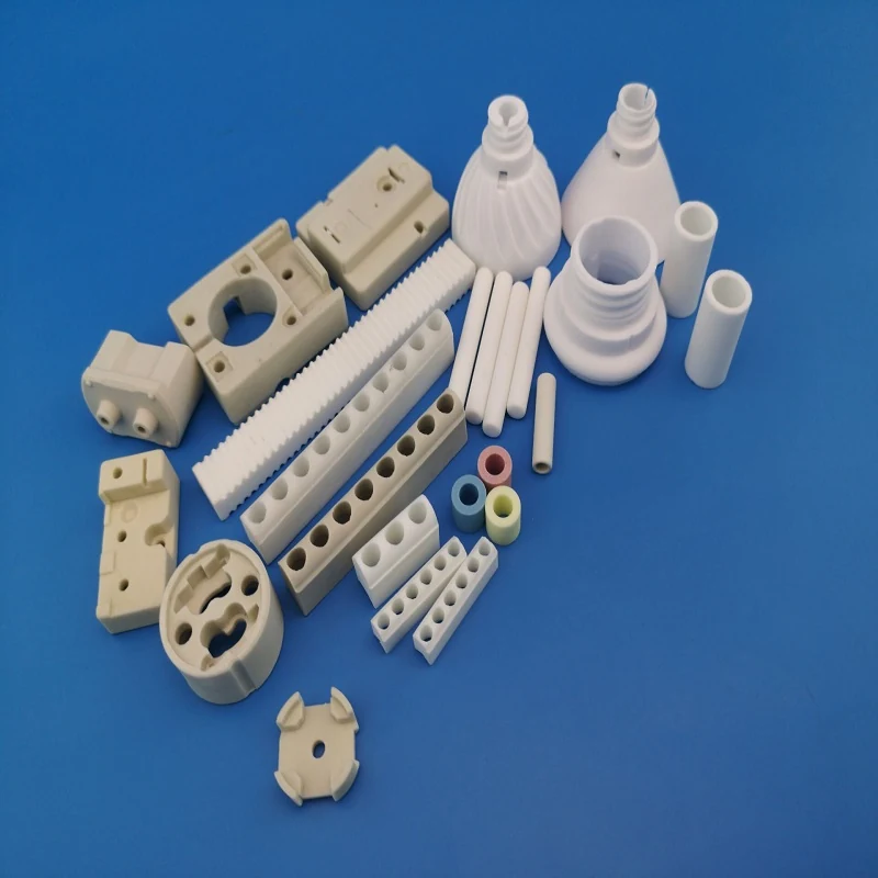 Large group of white steatite and alumina ceramic insulator components in many machined shapes