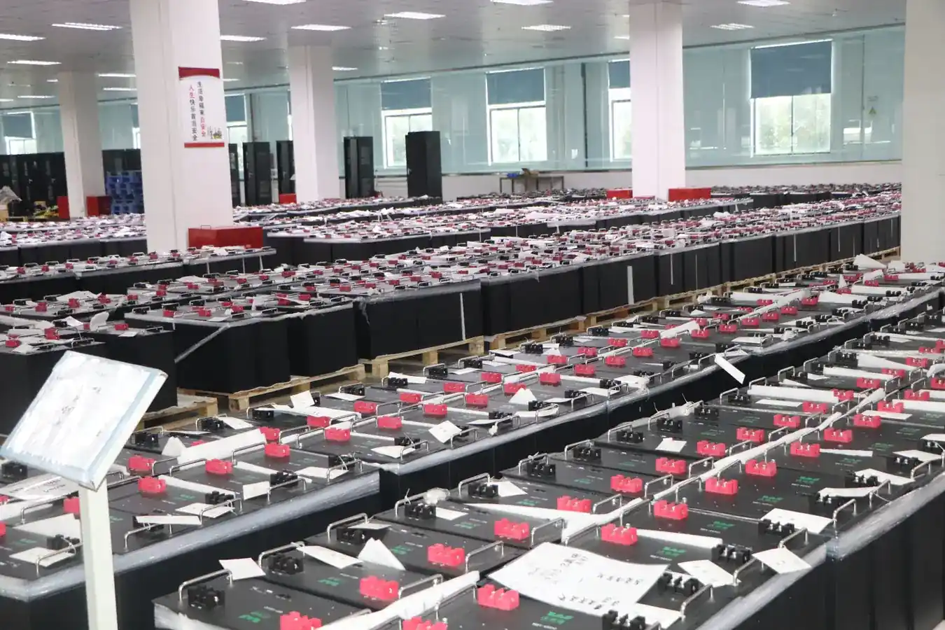 LiFePO4 battery modules stacked on racks in the ZP LITHIUM warehouse in Wuxi